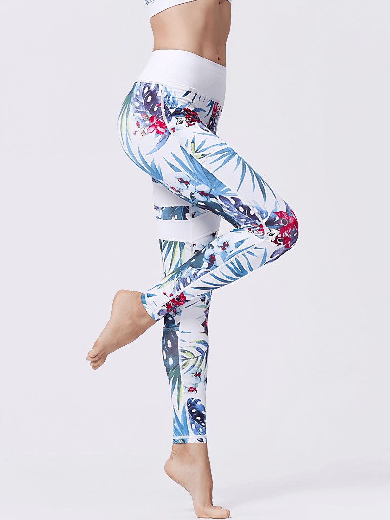 Side view of women's high-waist sports leggings with vibrant flower prints, perfect for yoga and fitness activities, featuring stretch fabric.