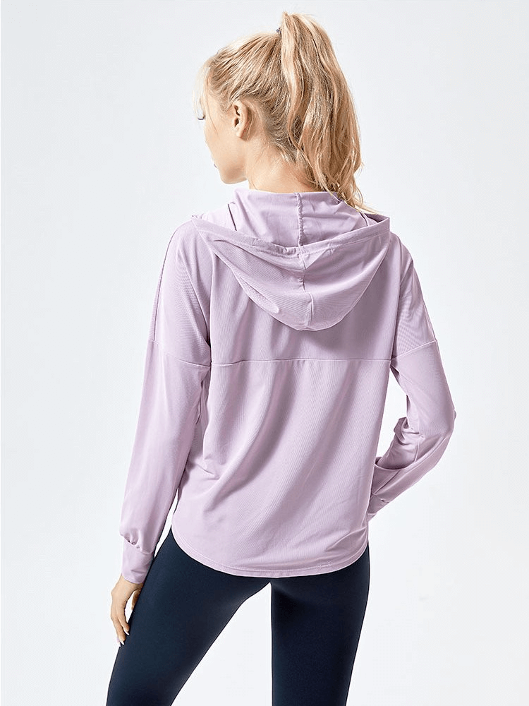 Back view of a woman wearing a lilac lightweight loose sports jacket with hood, ideal for yoga and running, showing full sleeve design.