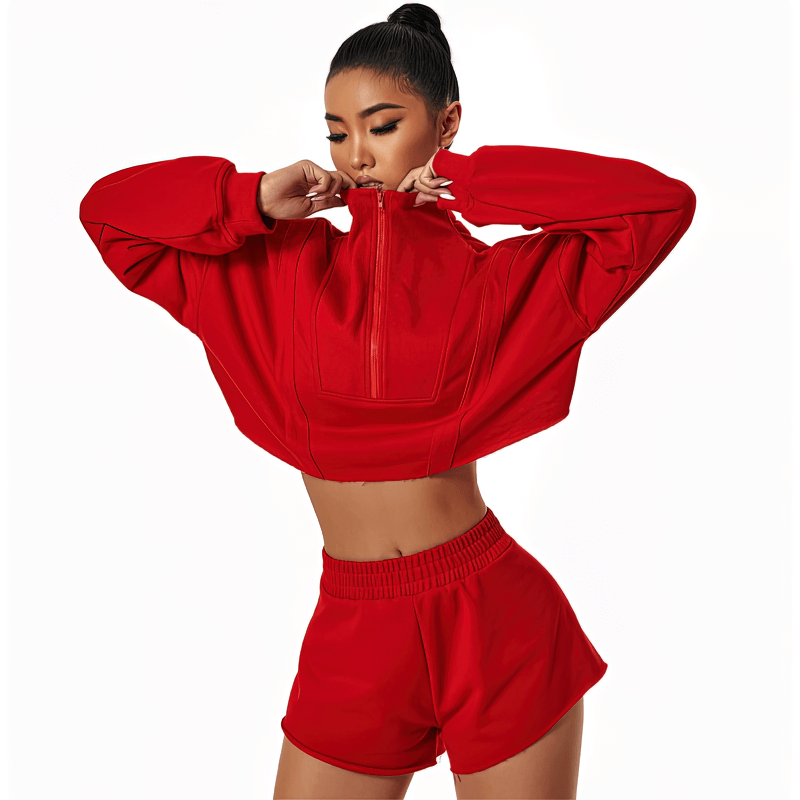Woman wearing a red loose long sleeve cropped sweatshirt ideal for yoga and workouts, showcasing a fashionable and breathable design.