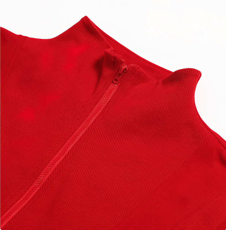 Close-up of a women's red cropped sweatshirt with a zipper, ideal for yoga and workouts, made from breathable cotton fabric.
