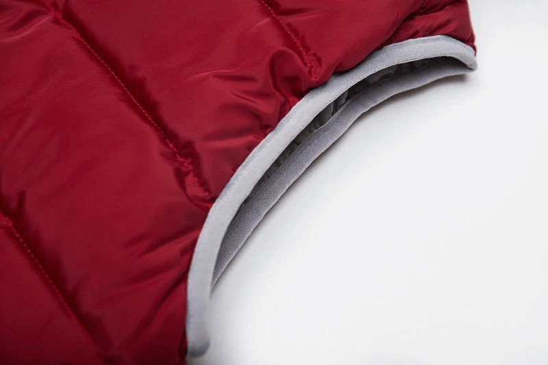 Close-up of red women's warm vest hood with grey lining, perfect for chilly seasons.