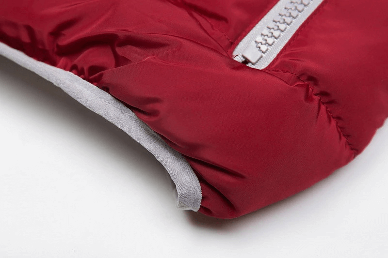 Close-up of a red women's vest hood with zipper, showing high-quality cotton and polyester material, perfect for cold weather.