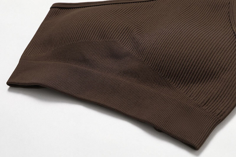 Women's one-shoulder sports bra in brown, breathable nylon spandex material, ideal for fitness activities. Model SF1045.