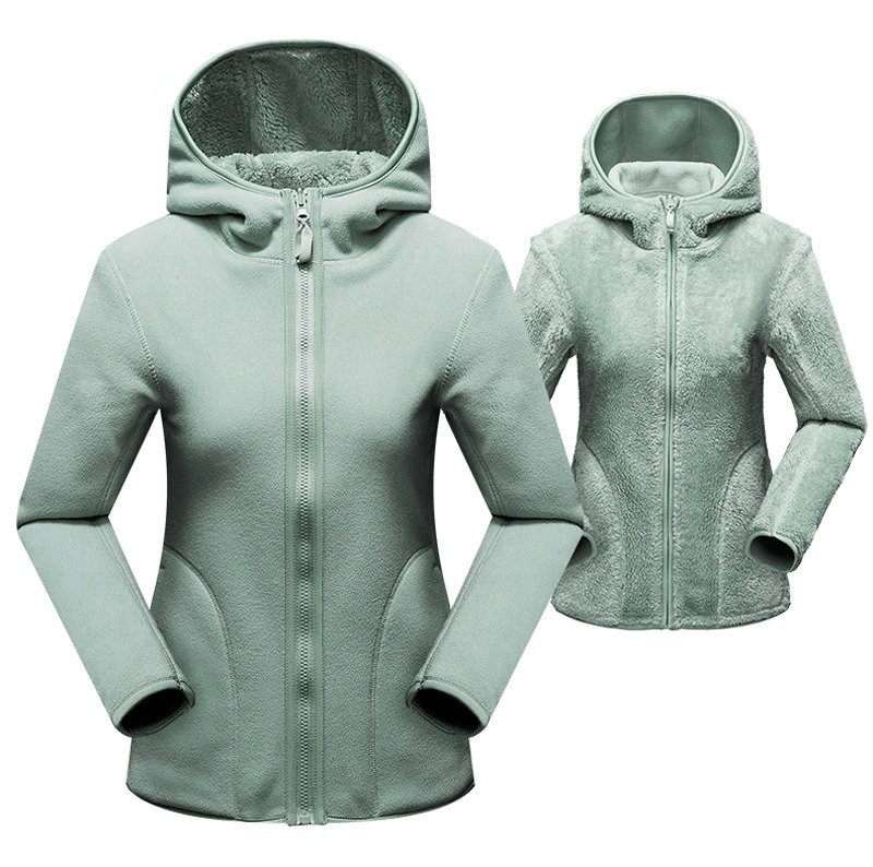 Women's reversible fleece jacket with hood in green, showcasing stylish zip pullover design and cozy fabric. Model SF0016.