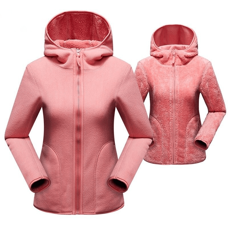 Women's reversible fleece jacket in pink, featuring stylish zipper pullover and hood, offering two fashionable looks in one.