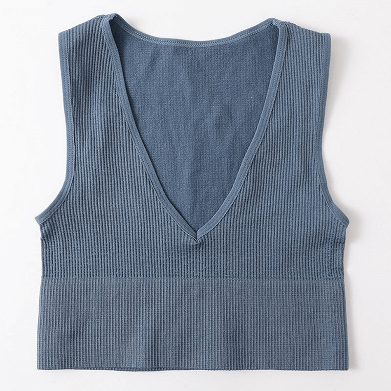 Women's ribbed seamless tank top in blue, featuring a deep V-neck and breathable fabric, ideal for yoga and running. Model SF0034.