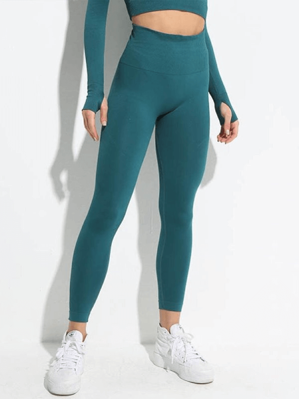 Women wearing seamless high waist yoga leggings in teal, made of nylon and spandex, perfect for flexibility and comfort during yoga sessions.