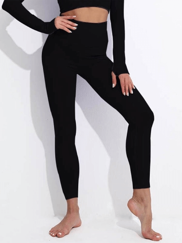 Women's seamless high waist yoga leggings in black, providing comfort and mobility, perfect for active pursuits.
