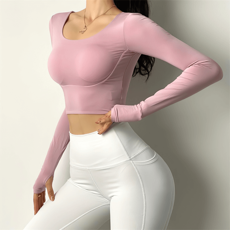 Women's sexy back long sleeves sports top in pink, perfect for yoga and running. High elastic, breathable fabric.
