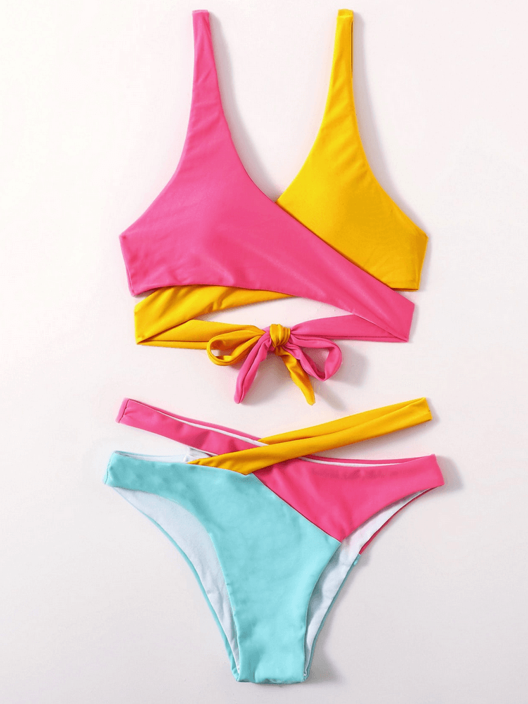 Women's sexy split swimsuit with colorful design and tie back, featuring low waist and wire-free support. Perfect beachwear fashion.