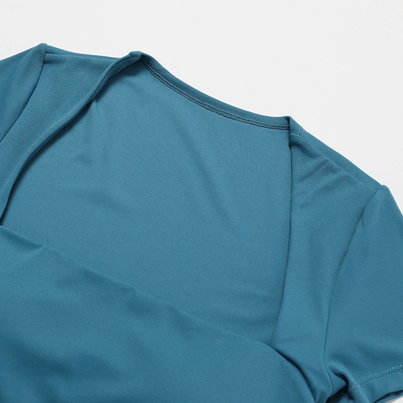 Women's blue nylon-spandex short one-piece sports suit top view, showcasing breathable, quick-dry features for fitness and training.