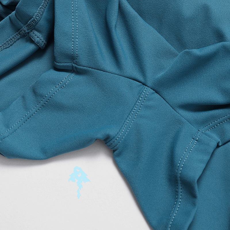 Close-up of a blue women's one-piece sports suit showing fabric texture and stitching for fitness training.