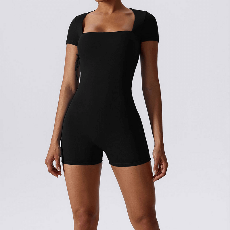 Women's black short one-piece sports suit for training, featuring anti-pilling, breathability, and quick-dry properties.