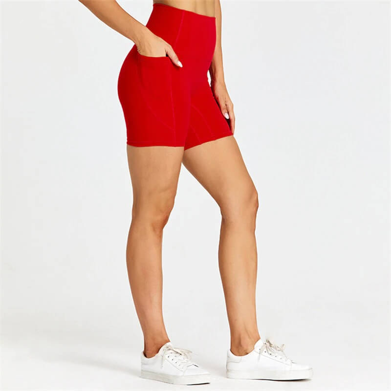 Women's short red solid color shorts with pockets, perfect for workouts. Nylon and spandex blend for mobility and comfort, style SF0407.