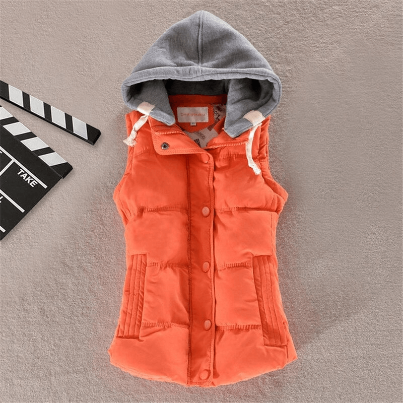 Women's sleeveless orange cotton jacket with hood and buttons, elegant casual vest on gray background.