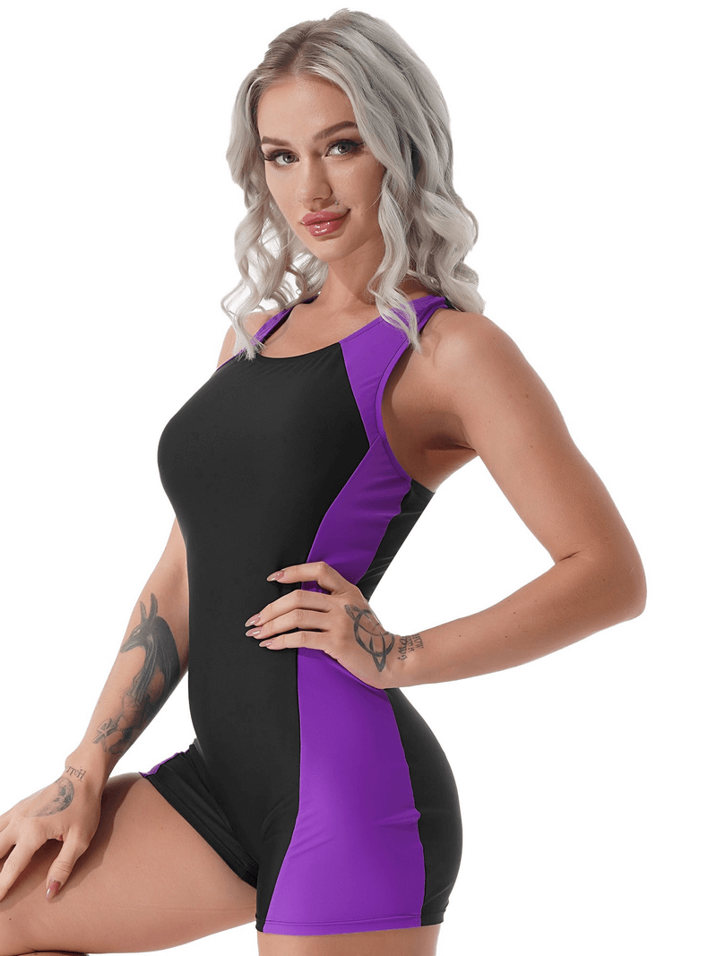 Woman modeling sleeveless black and purple one-piece swim jumpsuit, perfect for stylish swimmers seeking comfort and breathability.
