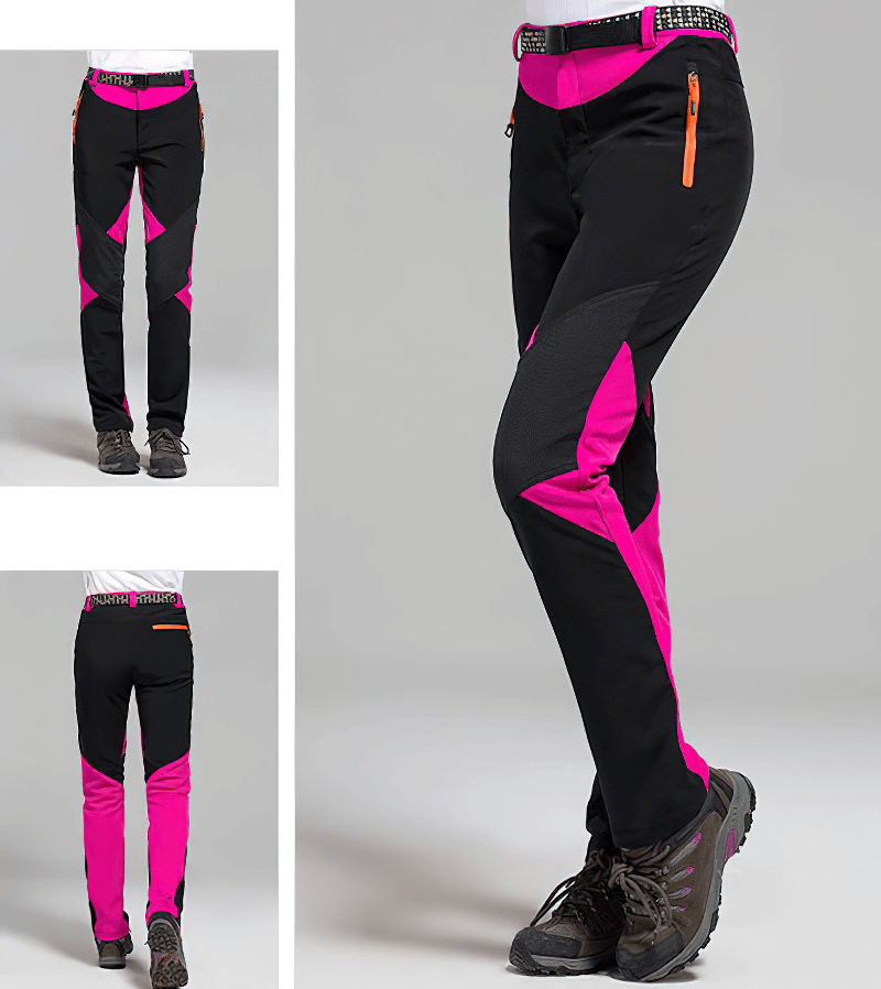 Women's Softshell Skiing Pants in pink and black with zipper, thermal and waterproof features, ideal for outdoor adventures.
