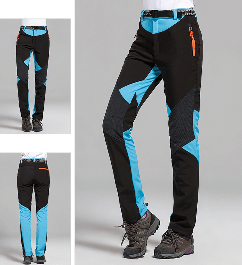 Stylish women's softshell skiing pants in black and blue with breathable and waterproof fabric, perfect for outdoor activities.