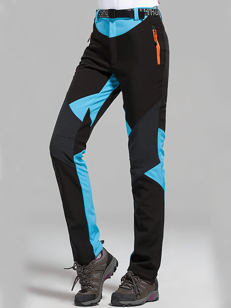 Women's Softshell Skiing Pants with blue panels, waterproof, windproof, and breathable, perfect for outdoor trekking.