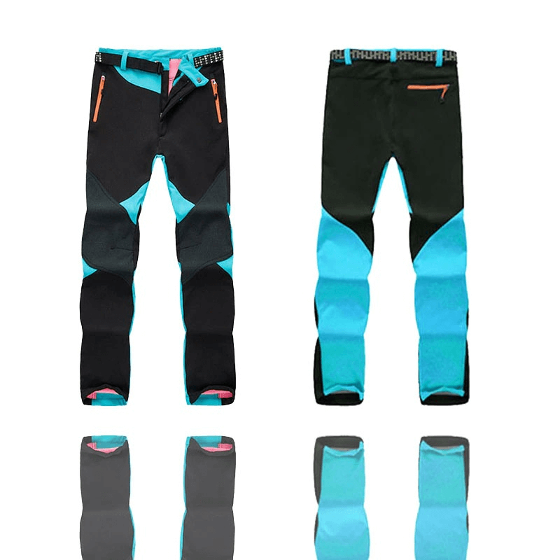 Women's Softshell Skiing Pants in black and blue, featuring fleece lining, windproof and waterproof technology. Ideal for outdoor trekking.