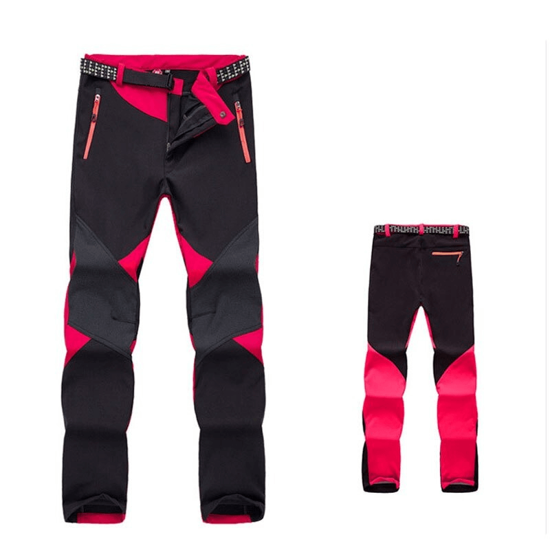Women's softshell skiing pants, red and black design, fleece-lined outdoor trekking trousers, waterproof, windproof, thermal fabric.