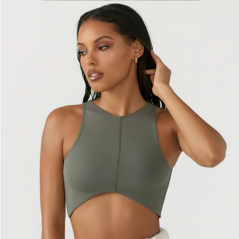 Women's solid sleeveless crop top with chest pad, backless design, ideal for gym workouts, shown on a model. Color: Olive Green.