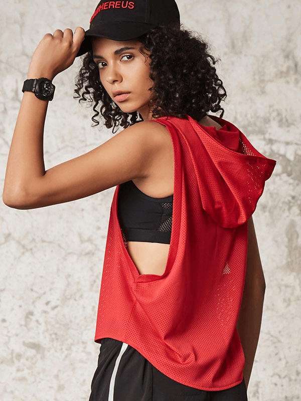 Woman wearing a red breathable mesh hooded tank top, perfect for yoga, running, and training, showcasing sporty style and comfort.