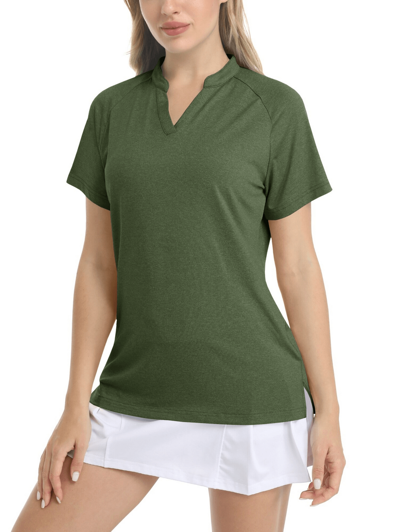 Woman wearing green v-neck short sleeve sports t-shirt with white skirt, showcasing casual sporty style