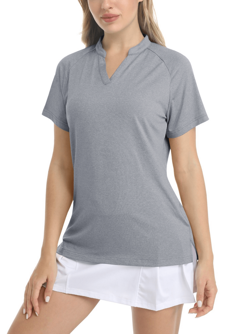 Woman wearing a gray slim-fit v-neck sports t-shirt with short sleeves and a white skirt, perfect for casual or sporty outfits.