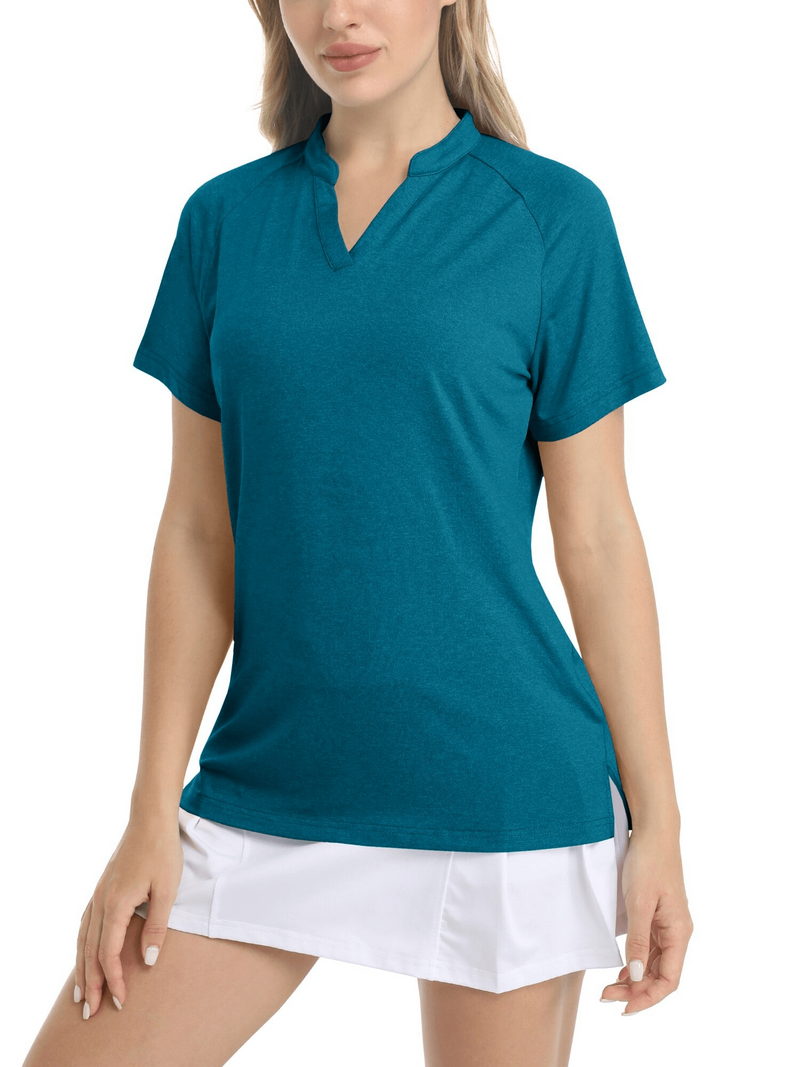 Woman wearing a teal v-neck slim short sleeve sports t-shirt paired with a white skirt.