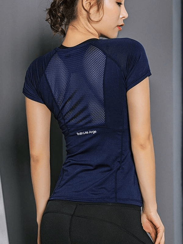 Woman wearing a navy blue quick-dry sports T-shirt with a transparent back, short sleeves, and stretchy fit, perfect for active workouts.