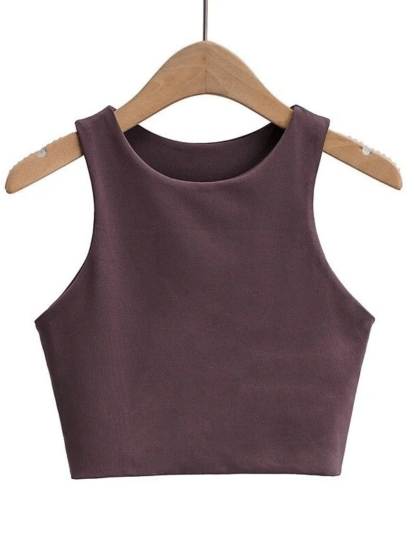 Cropped seamless workout top in plum, women's breathable spandex tank designed for comfort and mobility during fitness sessions.