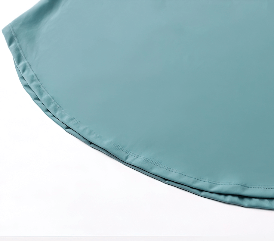 Close-up of women's sporty light top in blue with loose hem, designed for comfort with nylon and spandex blend. Perfect active wear for women.