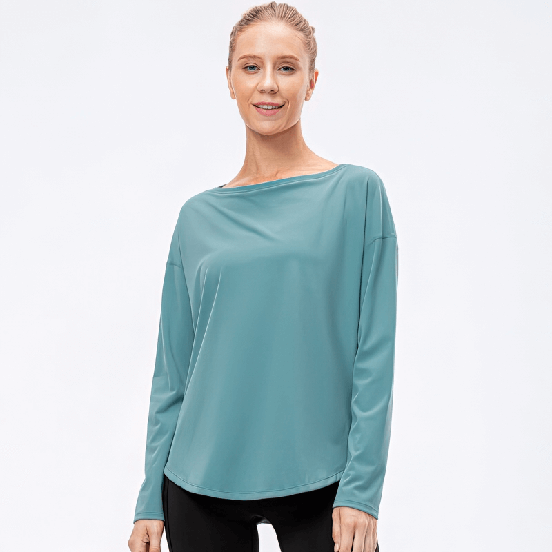 Woman wearing a sporty light loose top with loose neckline and long sleeves, perfect for active wear and comfort.