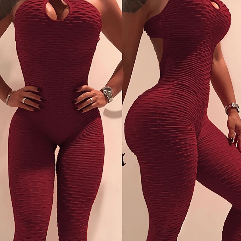 Women's textured open-back yoga jumpsuit in burgundy, showcasing sleek fit and breathable nylon fabric perfect for yoga practice.