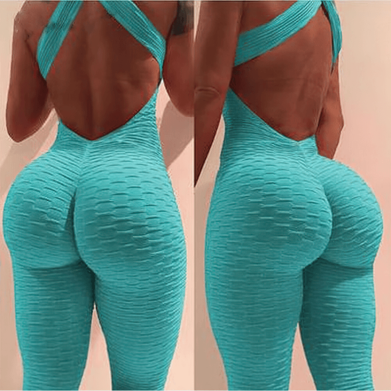 Women's textured open-back yoga jumpsuit, teal color, showcasing textured fabric and criss-cross straps for style and comfort.