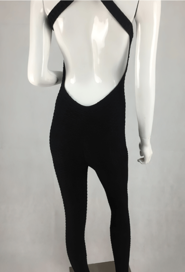 Back view of women's textured open-back yoga jumpsuit, SF0118. Lightweight, breathable nylon perfect for yoga sessions.