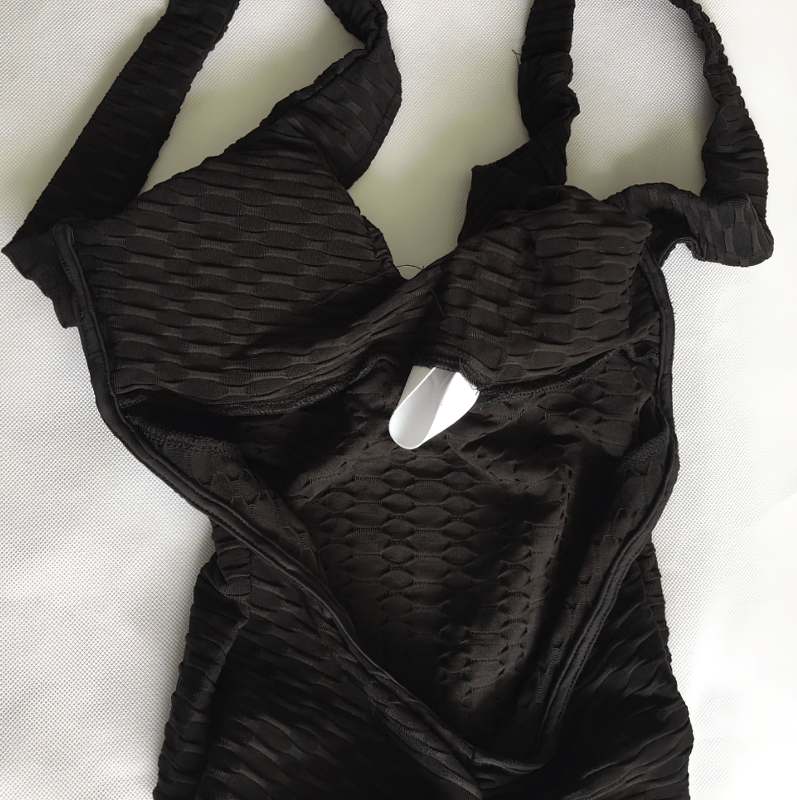 Women's Textured Open-Back Yoga Jumpsuit in black, lightweight and breathable with anti-pilling, wrinkle, and shrink features displayed.