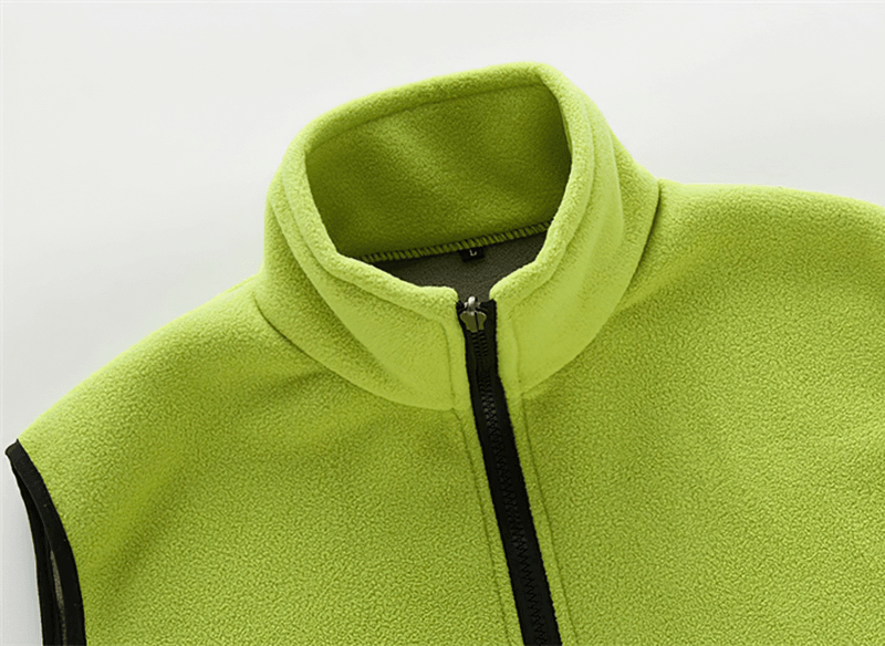 Women's thermal fleece vest with high collar and zipper, lime green, made of polyester, showcasing sleeveless design and breathable comfort.