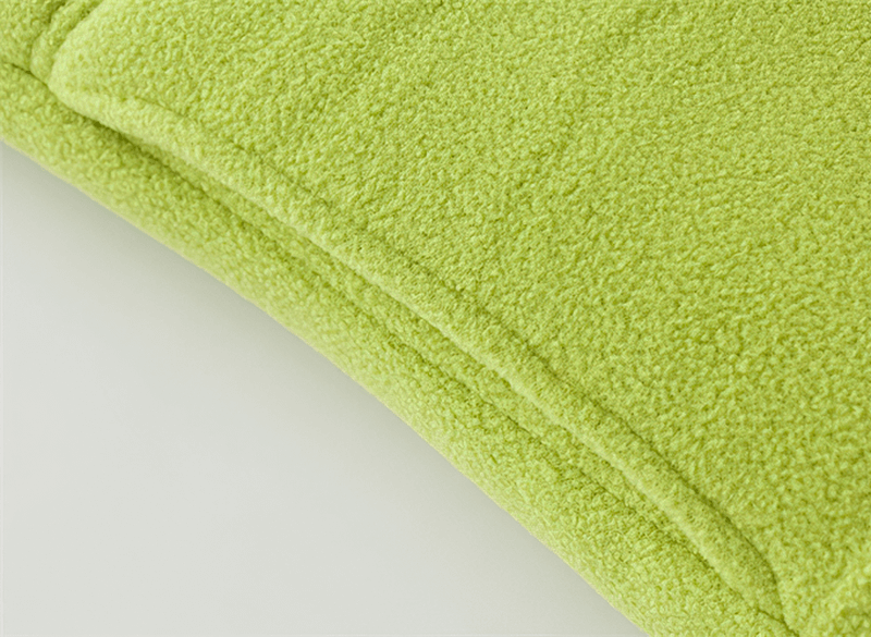 Close-up texture of lime green thermal fleece fabric for women's vest