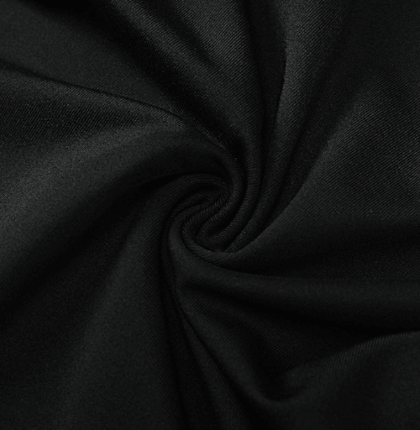 Close-up of black polyester fabric showcasing its smooth texture and quality, ideal for fashionable women's jumpsuits and playsuits.