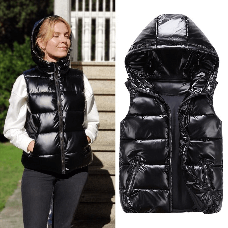 Women's shiny black hooded vest with zipper, shown worn outdoors and as a detailed close-up; stylish and warm option for cold weather.