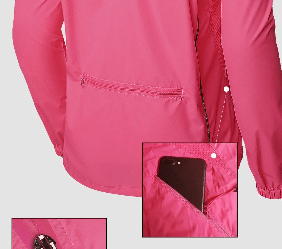 Women's pink waterproof bicycle jacket with reflective details, showcasing long sleeves and multiple zip pockets, perfect for outdoor sports.