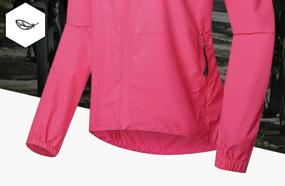 Women's pink waterproof reflective bicycle jacket with long sleeves and zipper pockets, perfect for cycling and hiking.