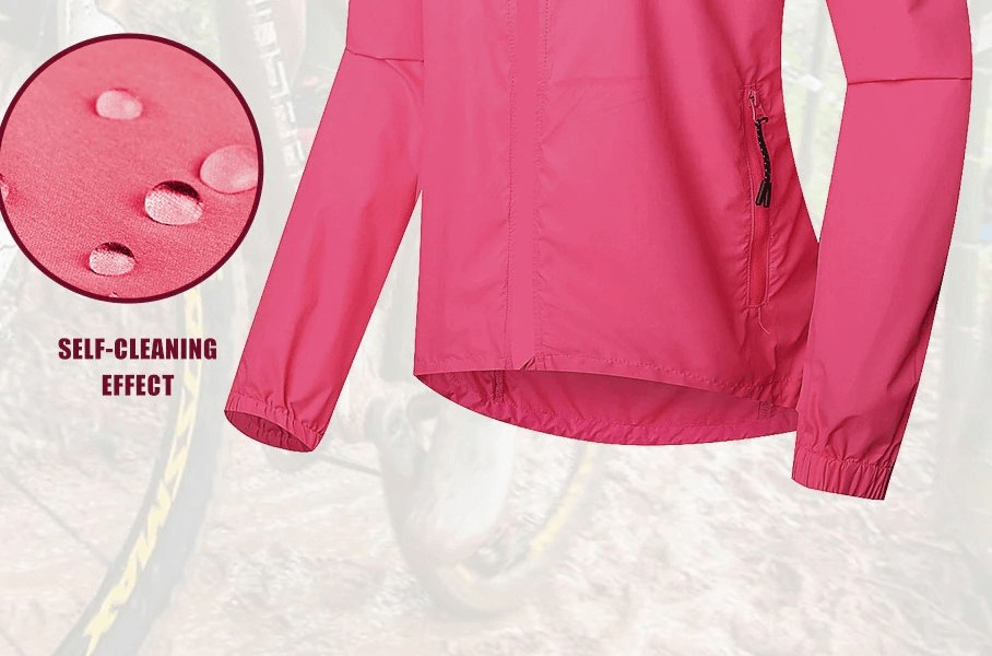Pink women's waterproof reflective bicycle jacket with long sleeves, showcasing self-cleaning effect. Designed for cycling and hiking.