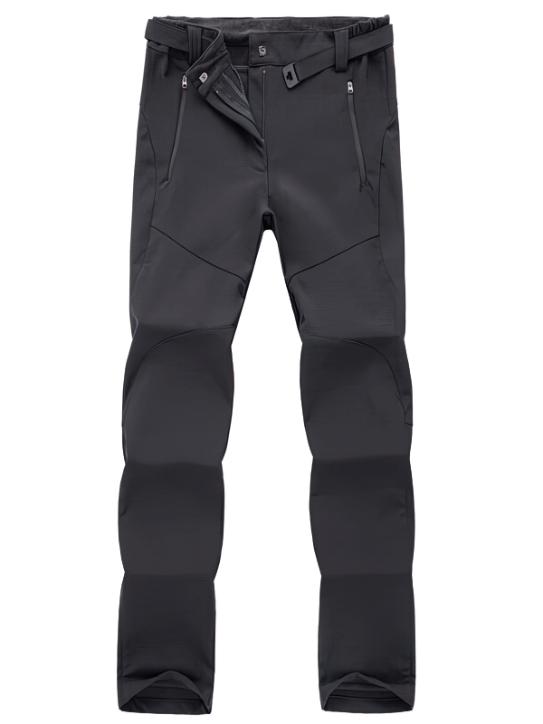 Women's waterproof sports pants in black, fleece-lined for hiking, featuring durable polyester, full-length design, and zipper fly closure.