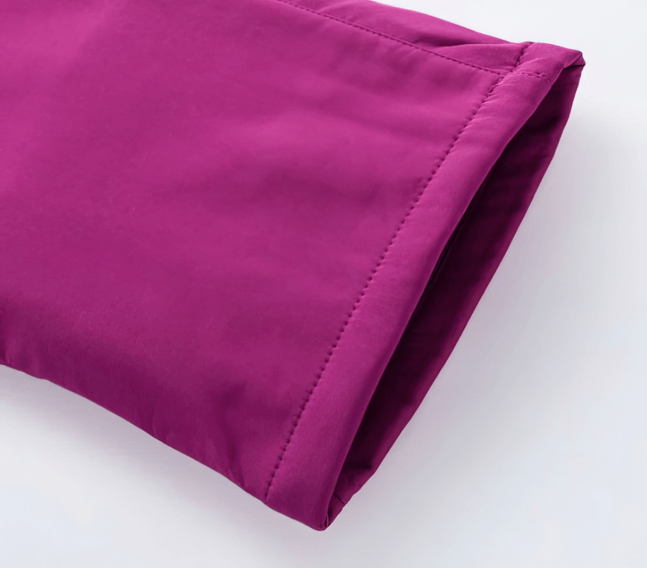 Purple women's waterproof sports pants, fleece lined, showcasing durable polyester fabric, ideal for hiking and outdoor activities.