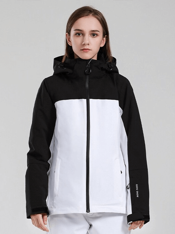 Woman wearing black and white windproof waterproof breathable ski jacket with hood, perfect for winter sports and protection in extreme conditions.