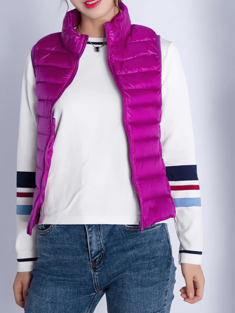 Woman wearing a vibrant purple windproof duck down vest with pockets, perfect for outdoor adventures in style and comfort.