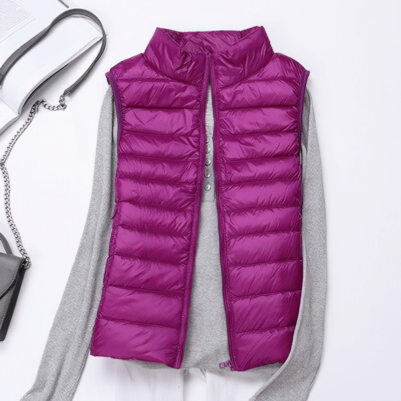 Women's purple windproof duck down vest with pockets, featuring a stylish waterproof zipper and lightweight design.